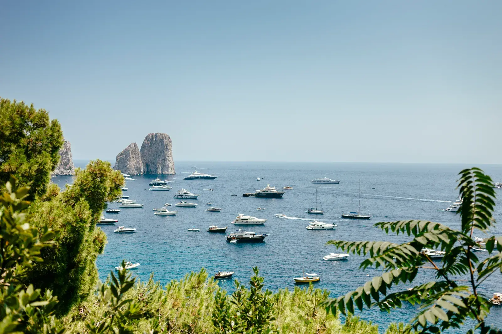 Serene coastal vista with luxury yachts anchored o